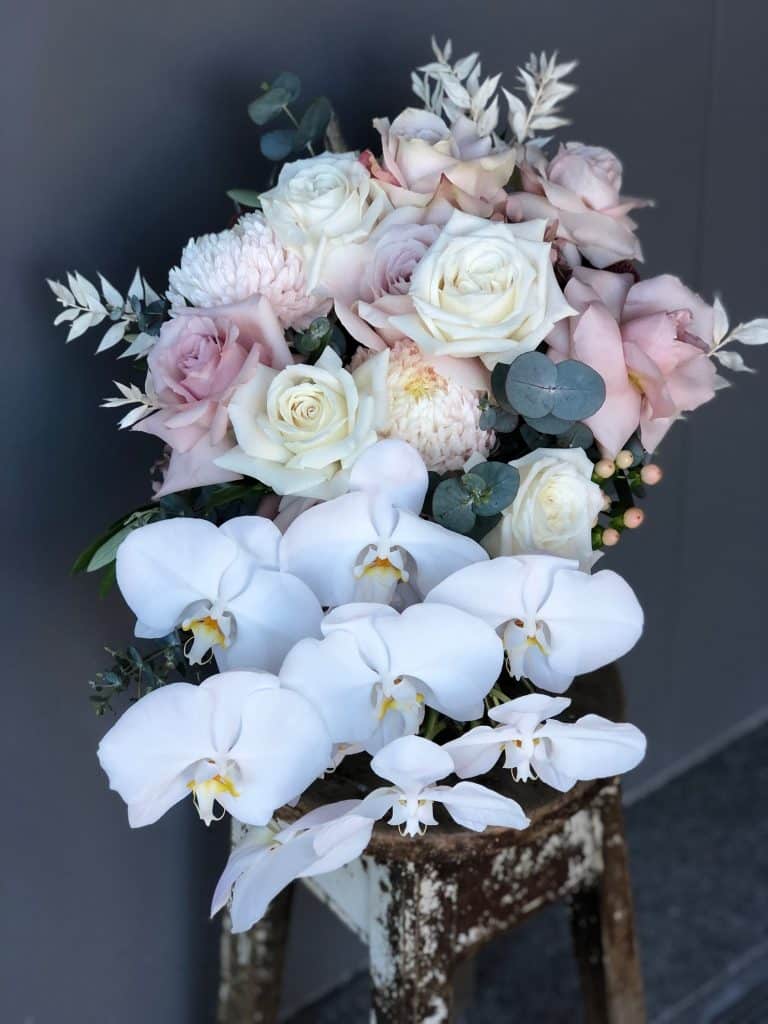 White and Pink Bouquet of Flower on a chair | Elsie and Oak Wedding Florist